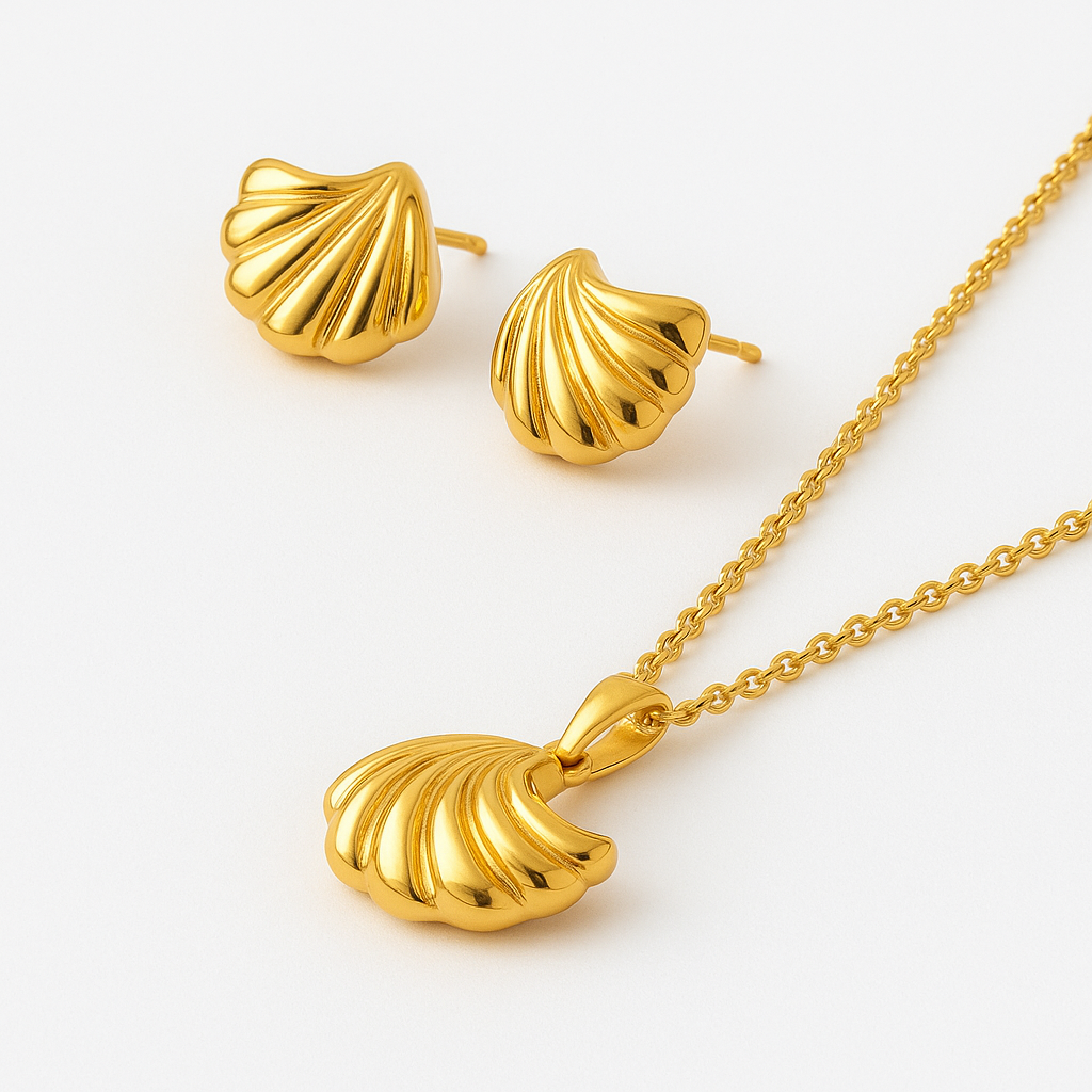 Gold shell-shaped jewelry set on a white background