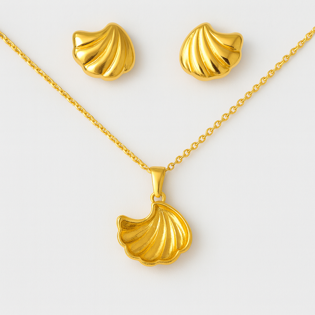 Gold shell necklace and earrings on a white background